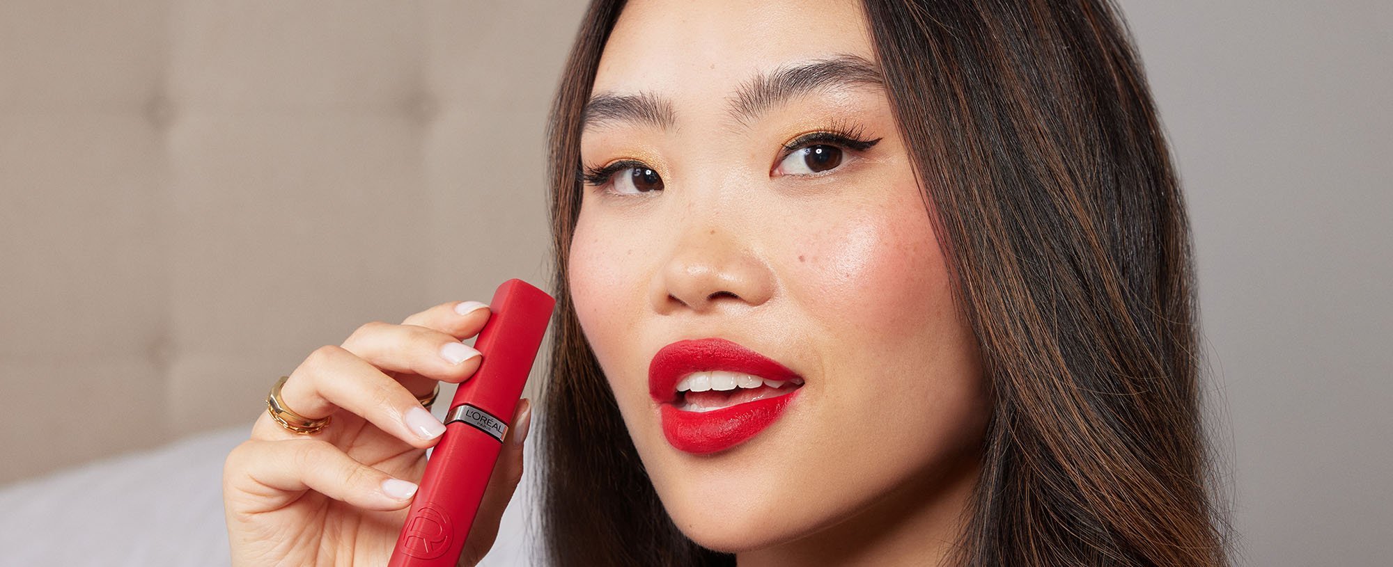 Person Holding Infallible Matte Resistance Red Lipstick