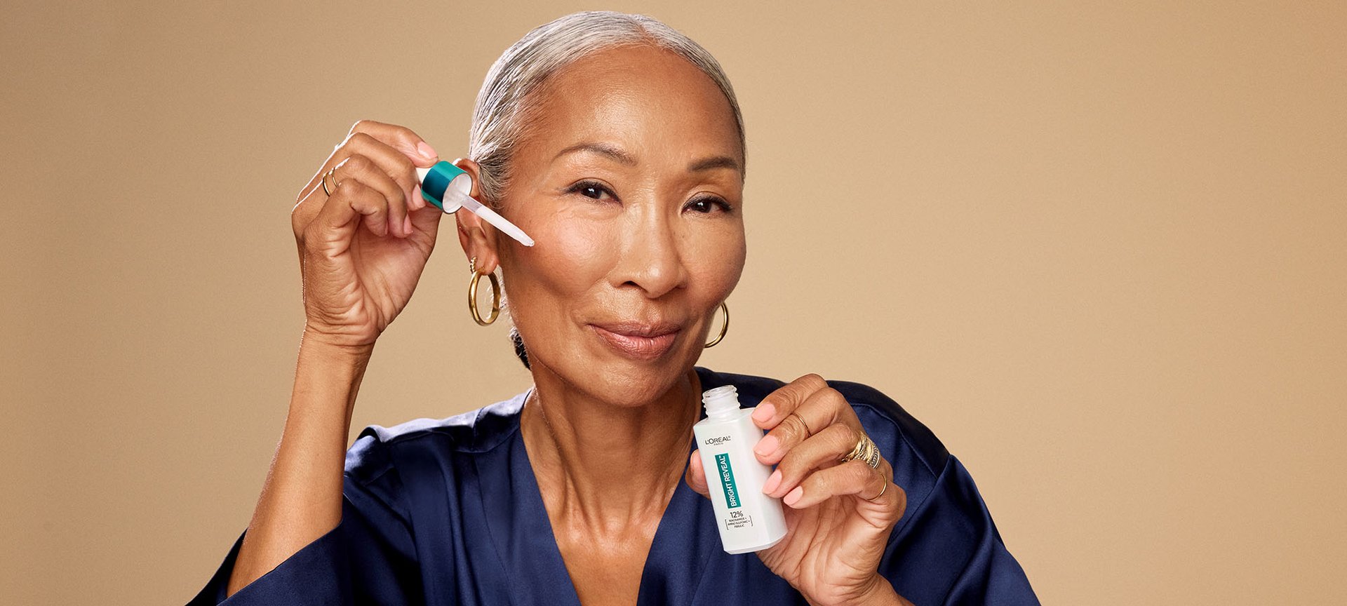 Person Holding Bright Reveal Niacinamide Serum