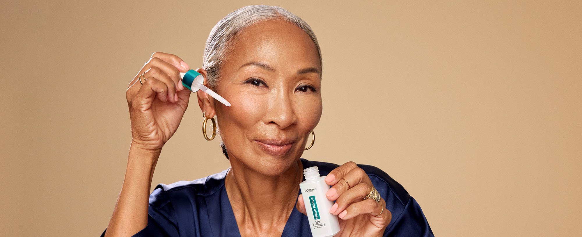 Person Holding Bright Reveal Niacinamide Serum