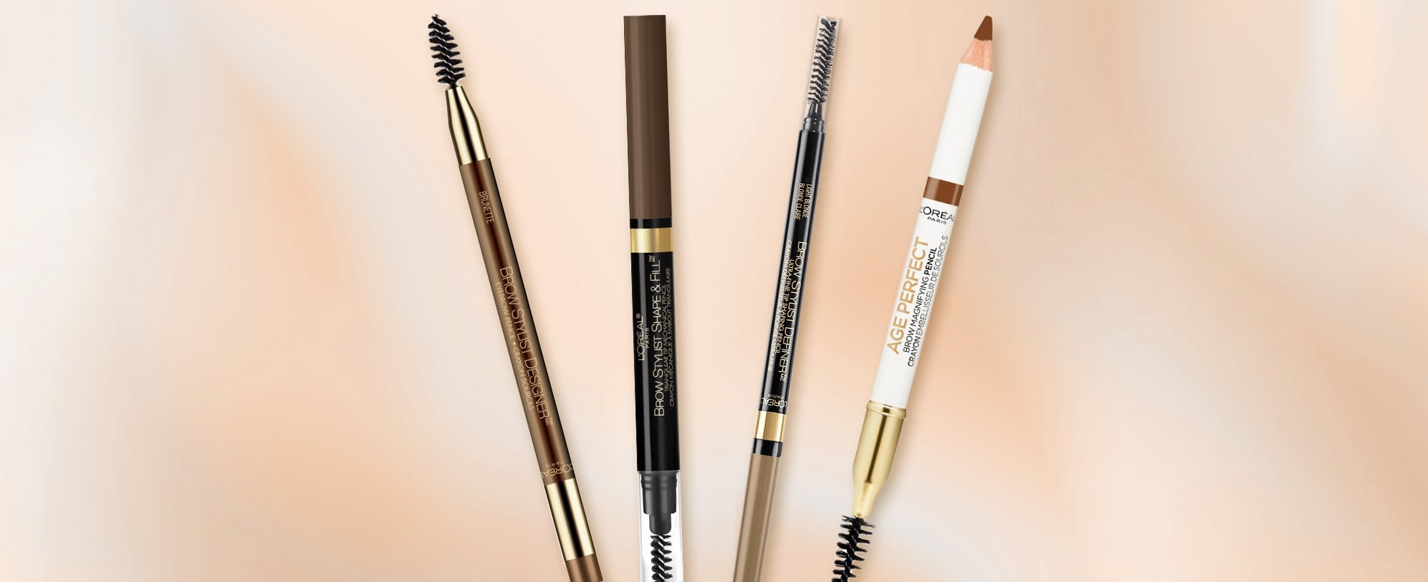 Four Loreal Paris Drugstore Eyebrow Pencils On A Beige Background