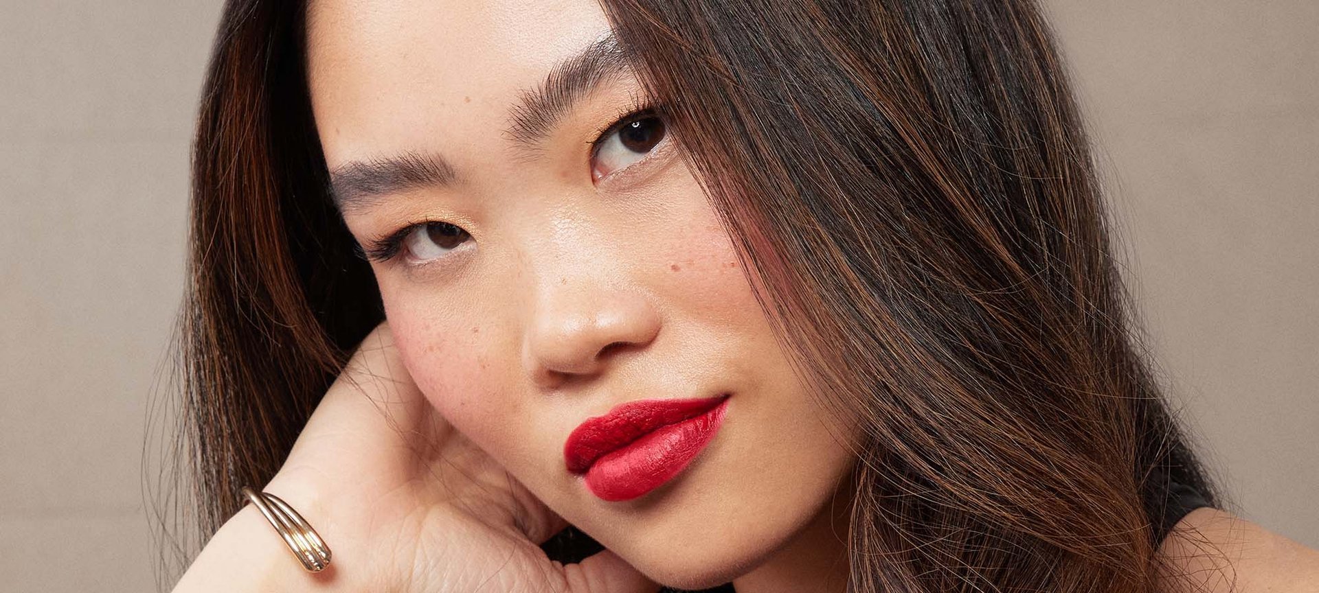 A Closeup Of A Person With Faux Freckles