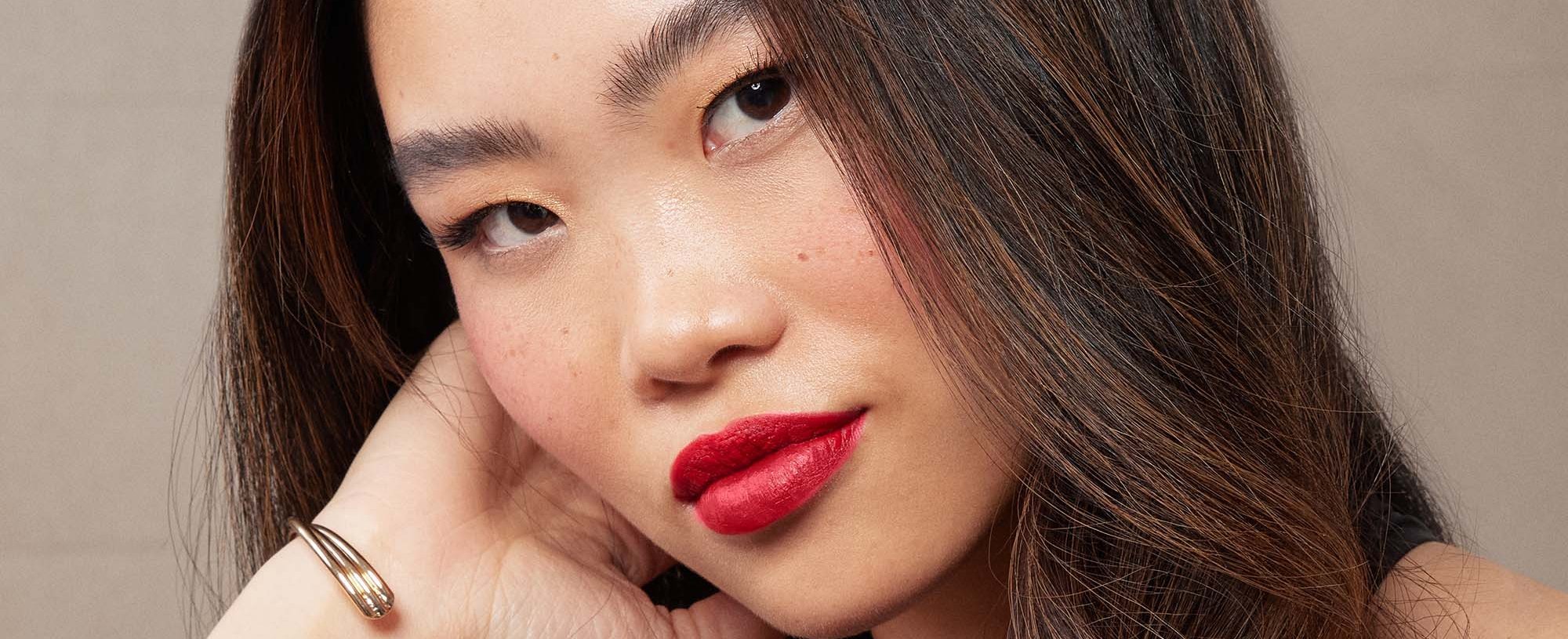 A Closeup Of A Person With Faux Freckles
