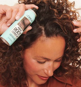 A Person Applying Loreal Paris Magic Root Spray On First Gray Hairs