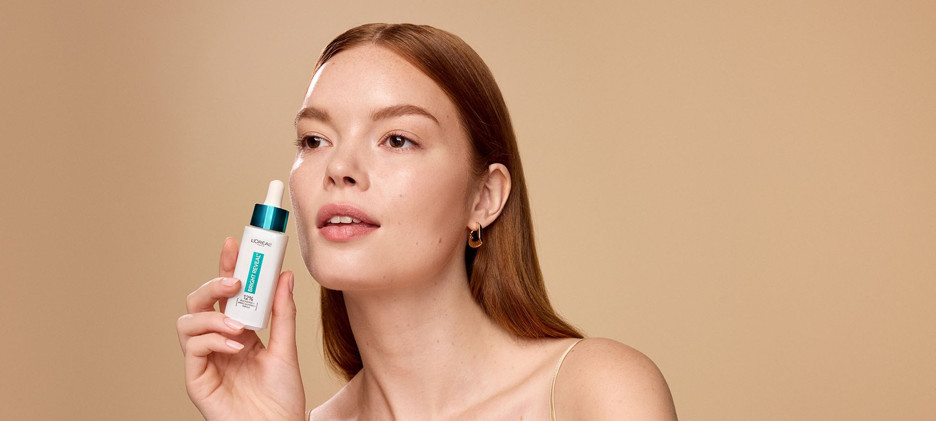 Person Holding Loreal Niacinamide Serum