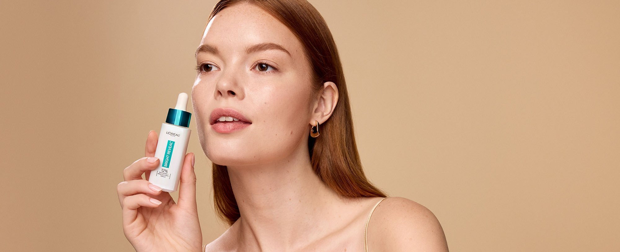 Person Holding Loreal Niacinamide Serum