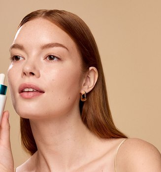 Person Holding Loreal Niacinamide Serum