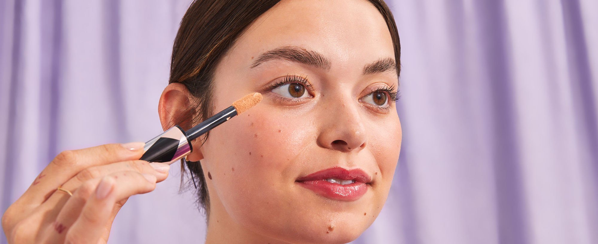 Person Applying Loreal Concealer For Dry Skin