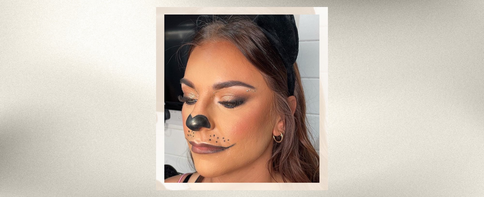 A woman in a cat like halloween makeup - desktop