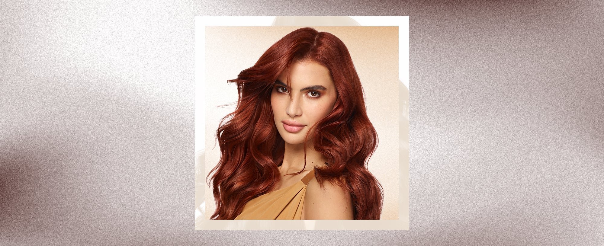 A woman wth long fluffy red hair - mobile