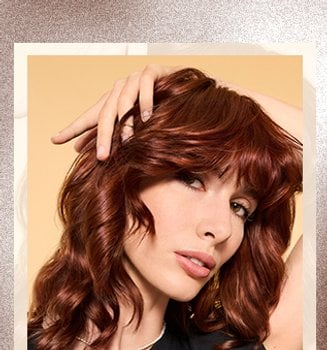 Layered wavy hair showing off a stylish and voluminous haircut, ideal for enhancing natural waves with added texture. - Mobile
