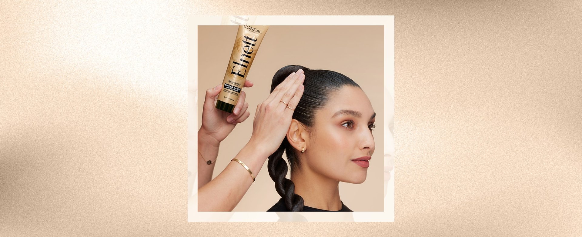 A woman with a sleek back ponytail