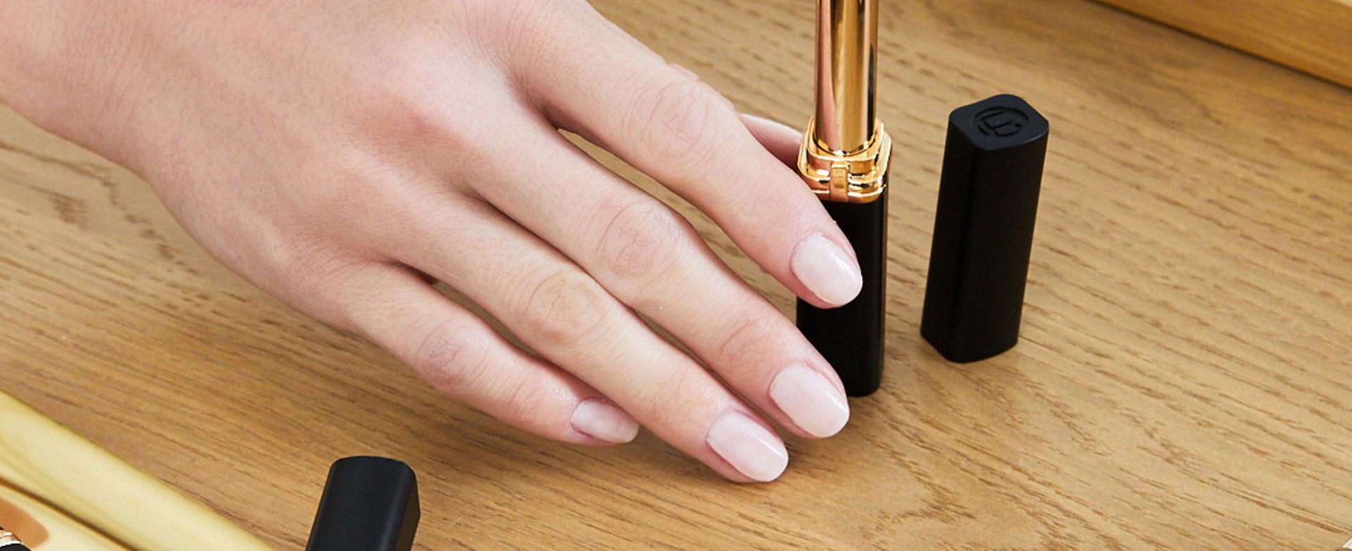 A woman wearing nude nail color
