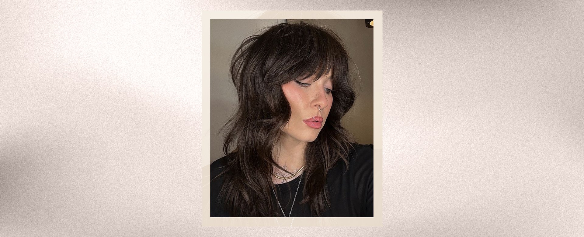 A woman with a bold wolf cut hairstyle