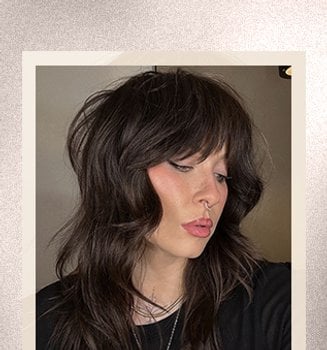 A woman with a bold wolf cut hairstyle
