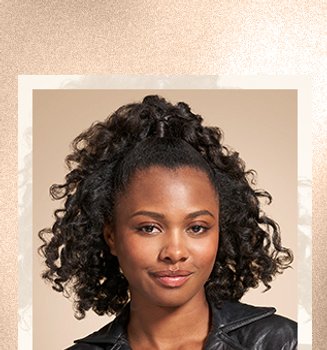 A woman with a curly hairstyle