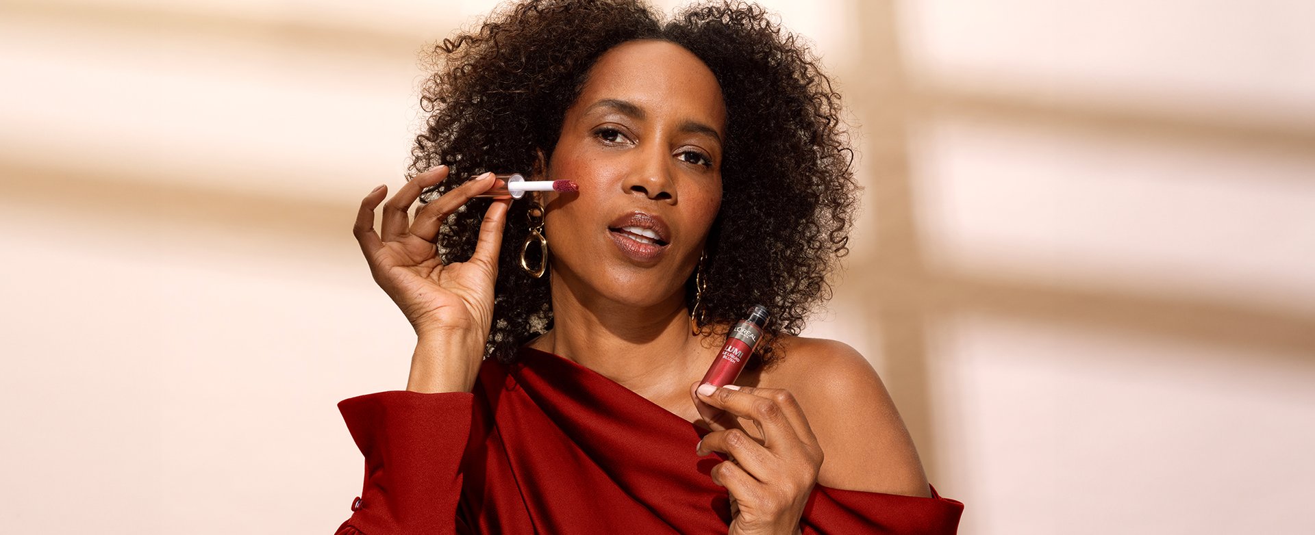 A woman with darker complexion using red blush