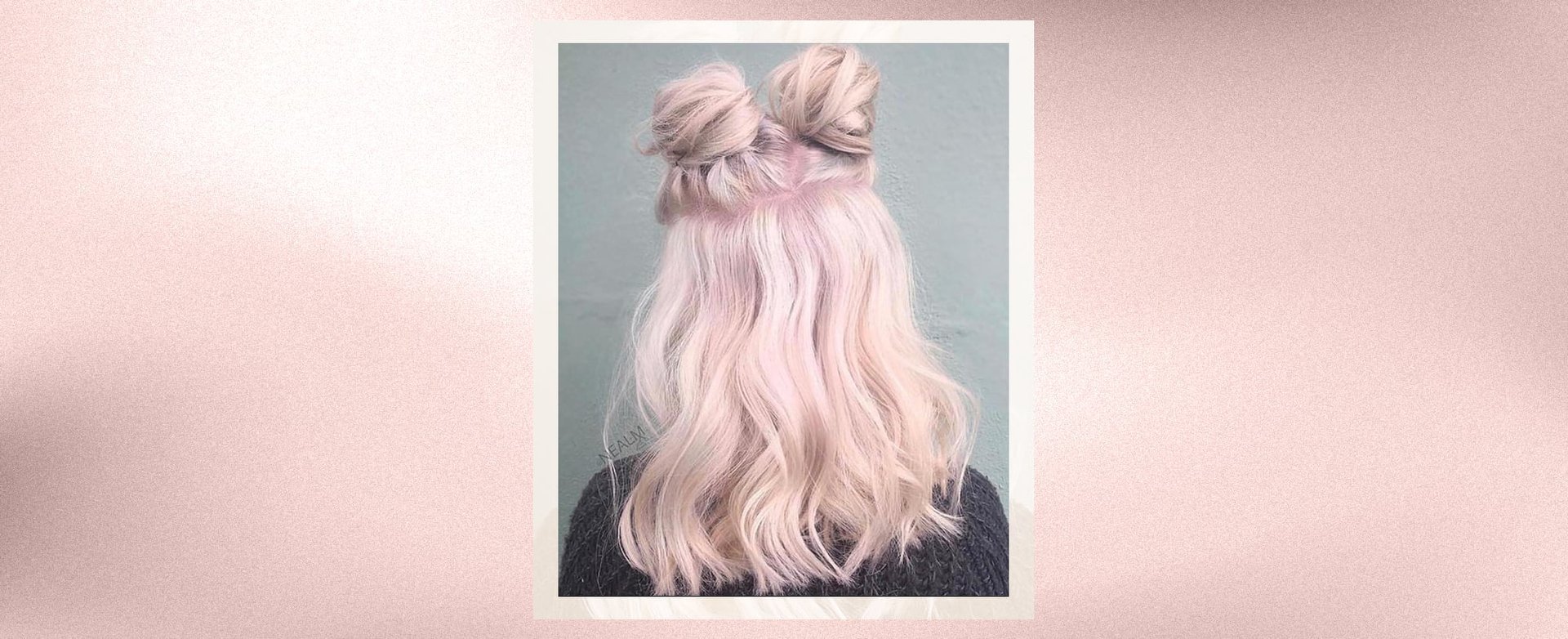 A person with pink space buns