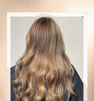 A woman with reverse balayage hair color
