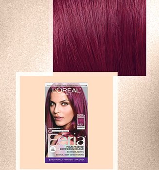 Woman with bold magenta hair color for dark hair, styled in loose waves to showcase the rich tones