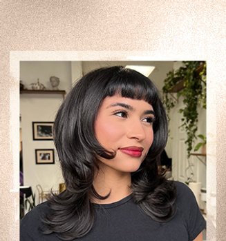 A woman wearing micro bangs hairstyle