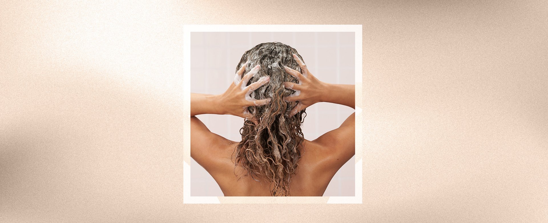 Person lathering their hair with shampoo