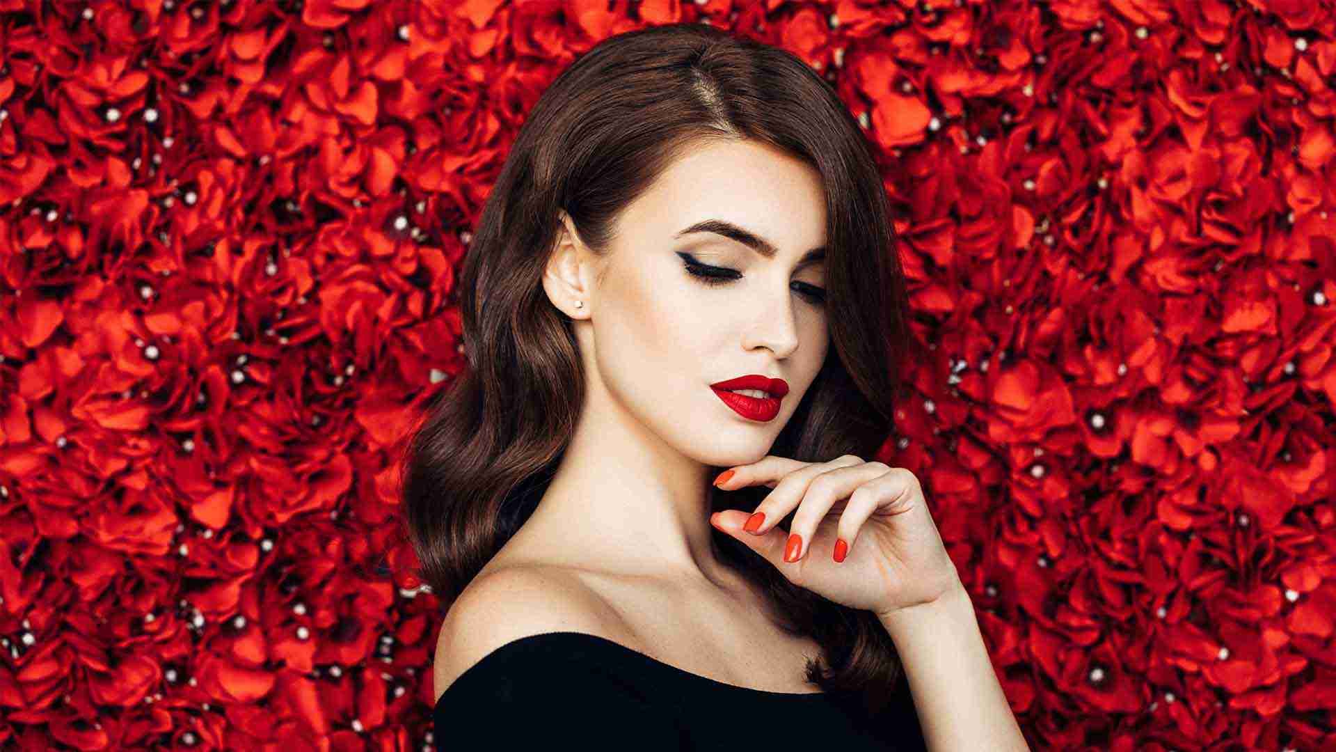 Premium Photo | Fashion beauty portrait of glamorous fashion model wearing  red evening gown. long dark shiny hair with hollywood wave hairstyle, makeup  and rose flower